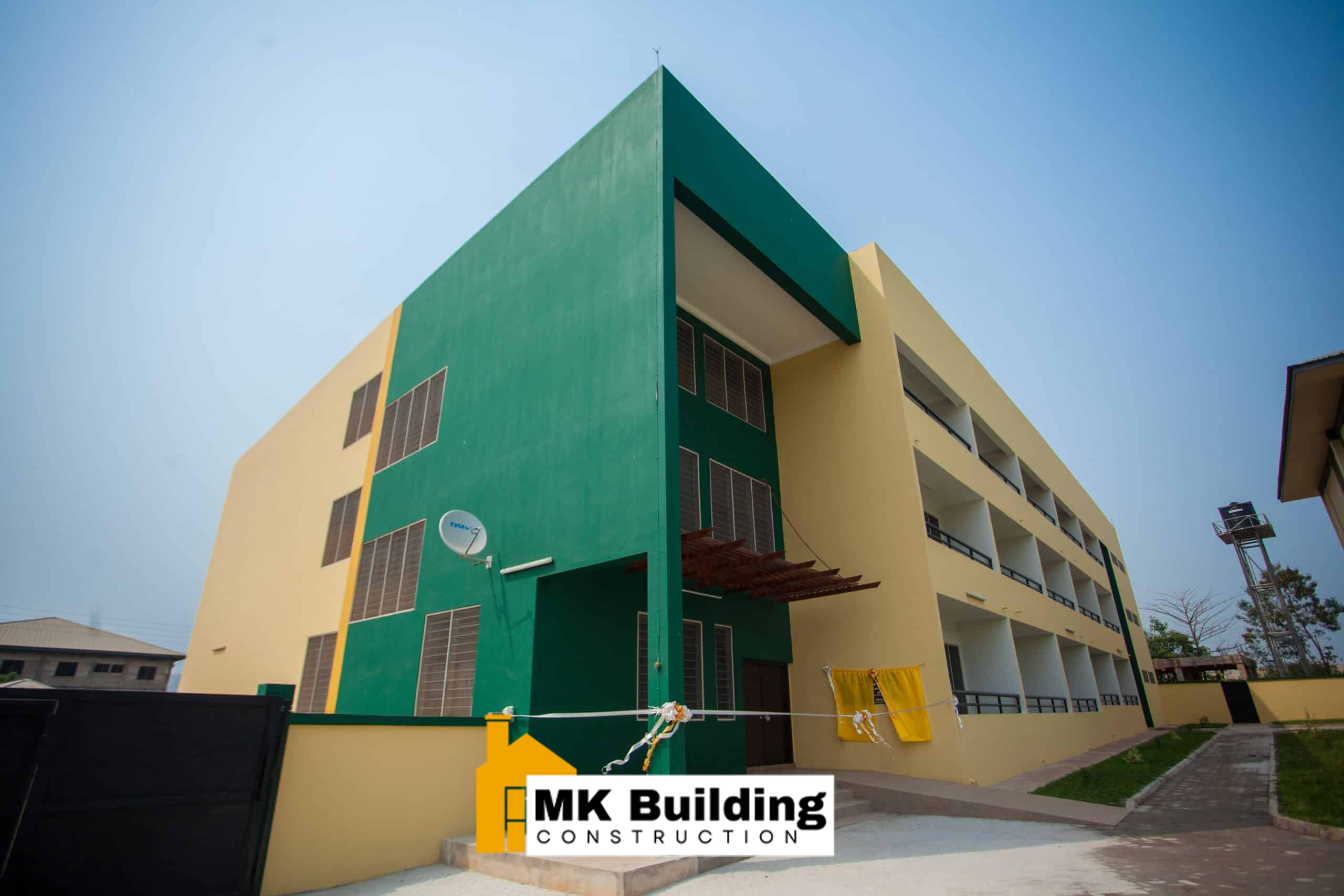 Modern glass commercial tower under construction in Accra